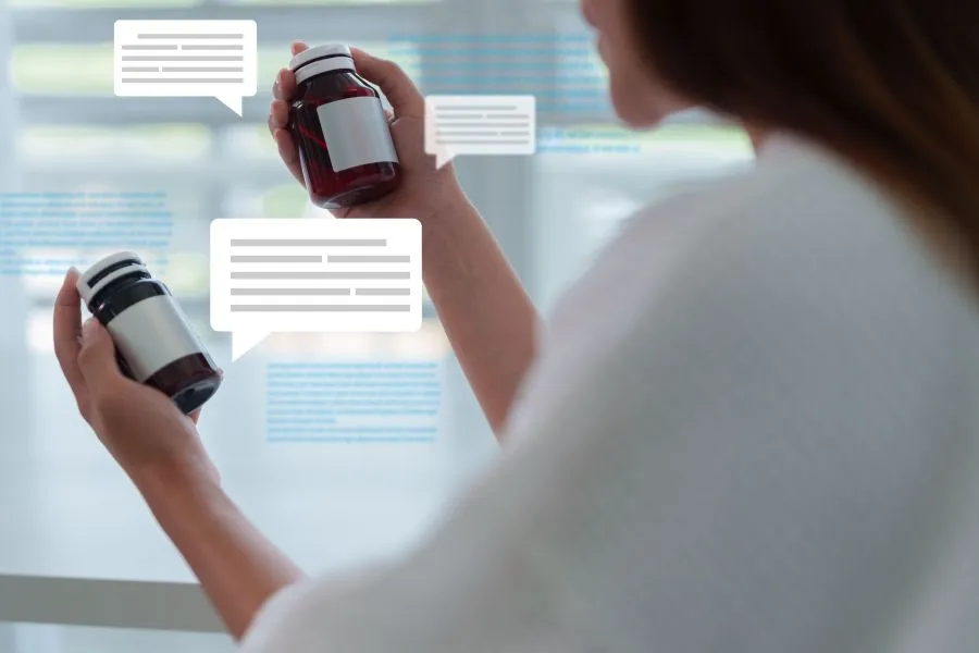 woman reading labls on supplement bottles
